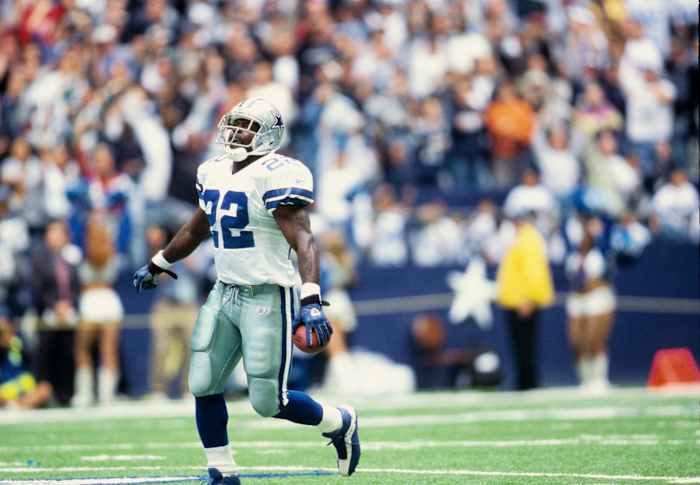 Dallas Cowboys running back Emmitt Smith celebrates a touchdown.